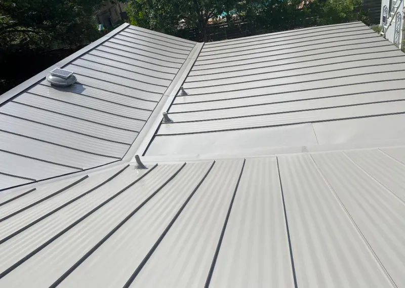 Solar attic fan installed on a metal roof for Roof Ventilation in Hellam